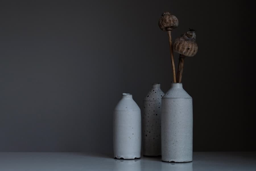 Hands shaping wet clay at a ceramics wheel